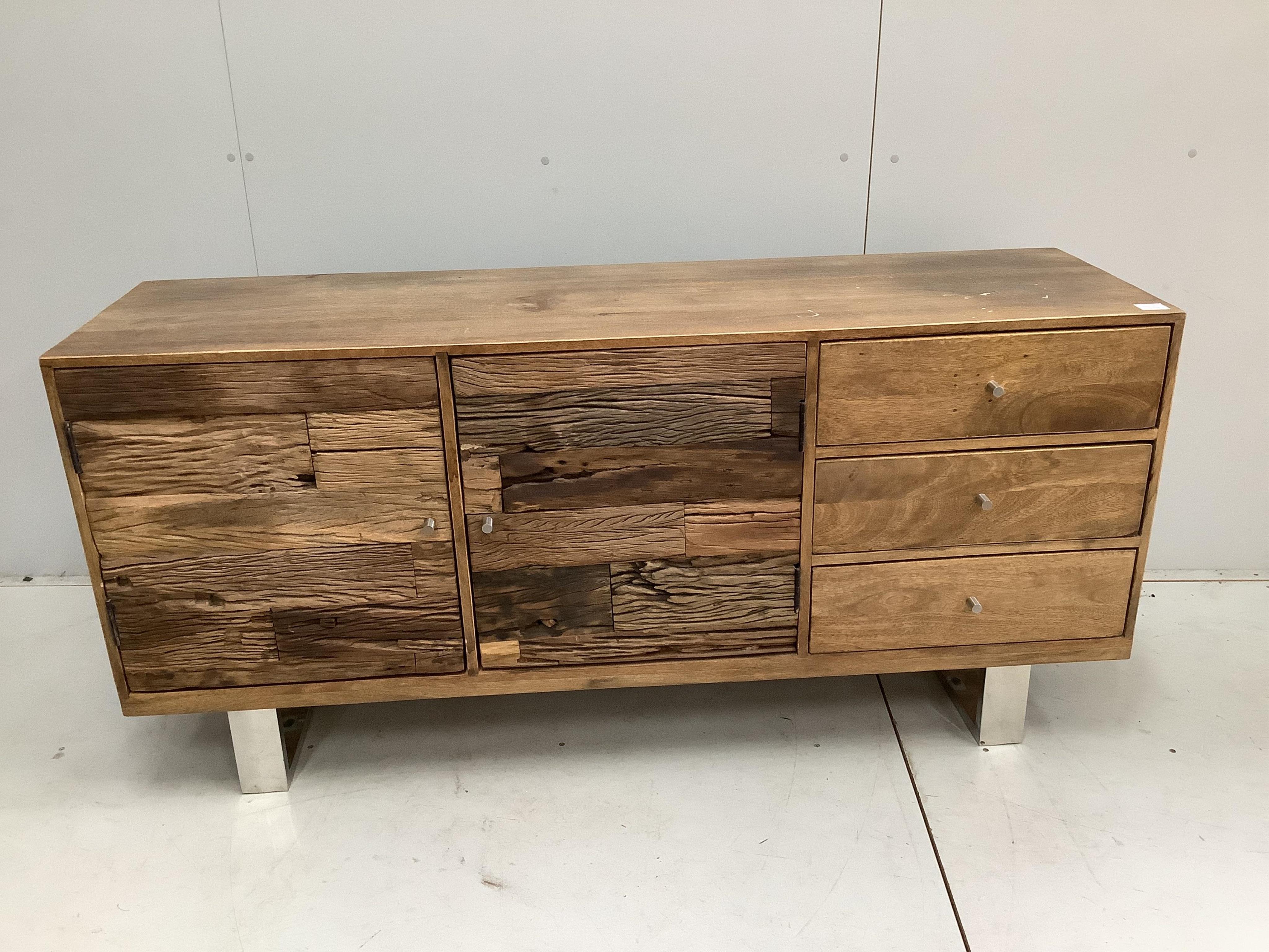 A Contemporary hardwood and weathered wood sideboard on chrome feet, width 161cm, height 76cm. Condition - a little faded with some staining to the top, otherwise good